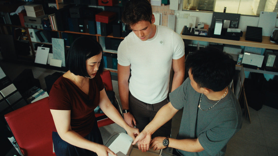 Jack Bloomfield reviewing tile samples with factory partners at the source